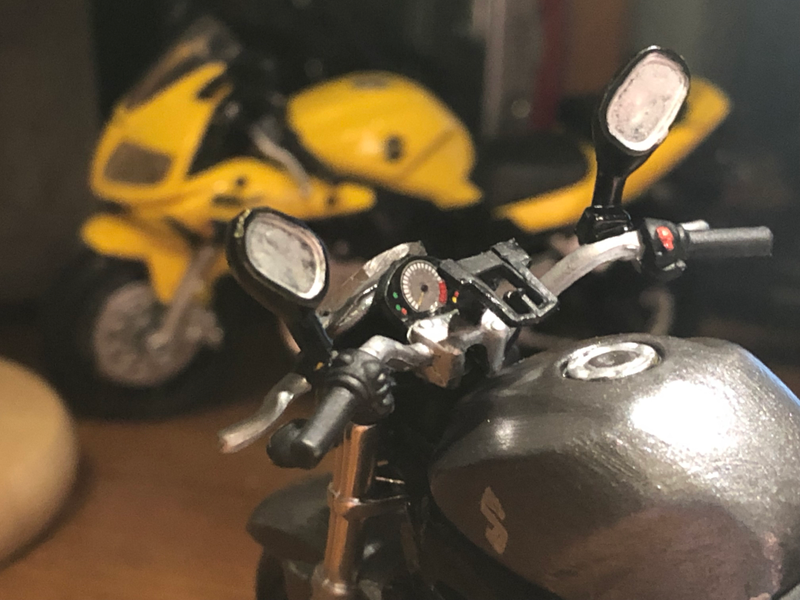Also added in 2005 in addition to the black frames were twin spark plugs per cylinder, which was good for 73 hp from the 645 cc V-twin. His bike retains the clip-on style bars, where I adopted mine from a Harley XG750 Street.